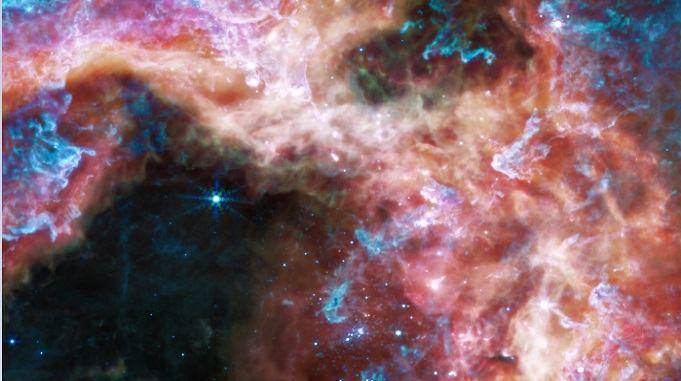 nasa james webb tarantula nebula, 30 doradus tarantula nebula, 30 doradus star forming region, nasa tarantula nebula facts, what is tarantula nebula, space science news in hindi, जेम्स वेब स्पेस टेलीस्कोप, टारेंटयुला नेबुला, नासा